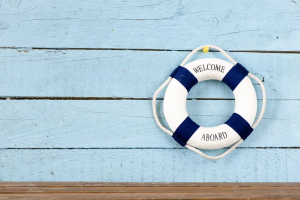 Lifebuoy on wooden background — Stock Photo, Image