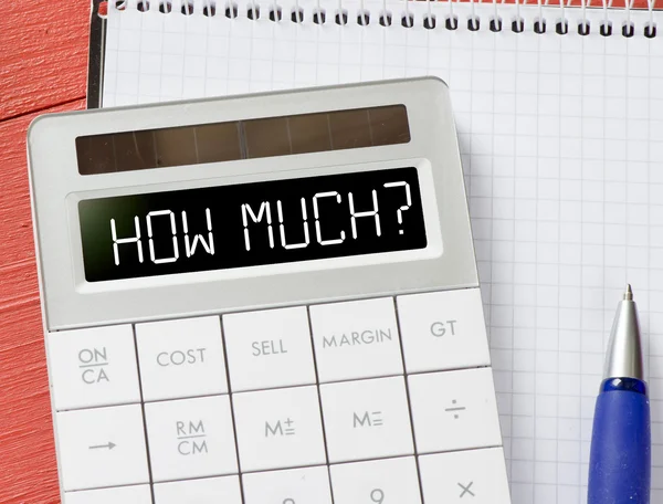 Calculator with how much? — Stock Photo, Image