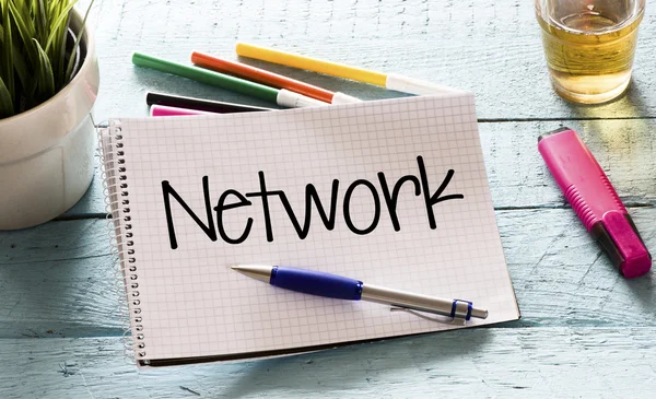 Notepad with network and markers — Stock Photo, Image