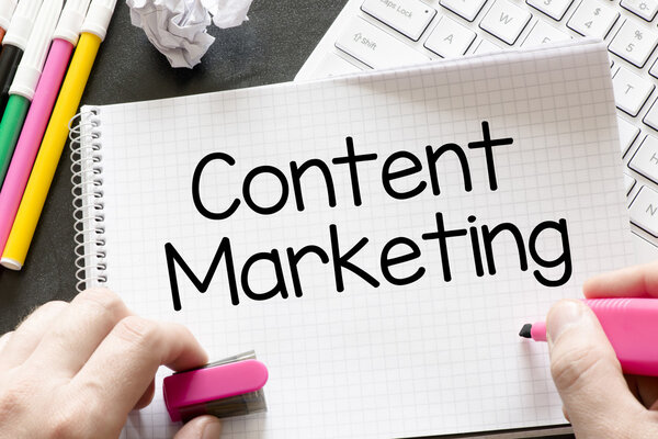 Hands with paper and  content marketing