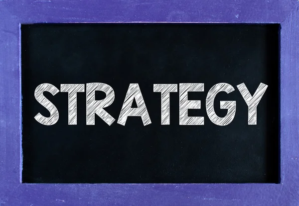 Strategy word On blackboard — Stock Photo, Image