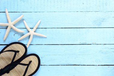 Deniz yıldızı ve parmak arası terlik arka plan