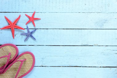 Deniz yıldızı ve parmak arası terlik arka plan