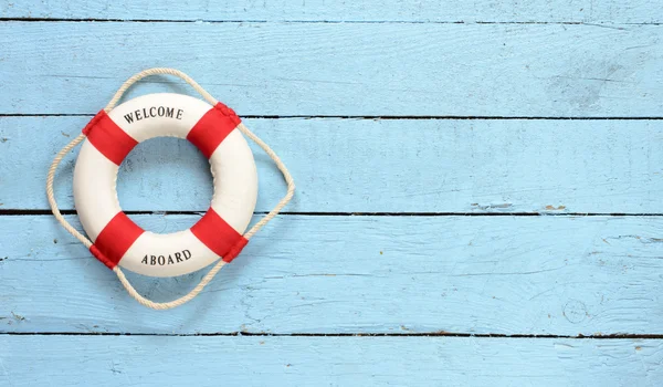 Lifebuoy  on wooden background — Stock Photo, Image