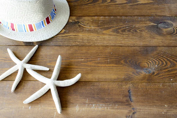 Bakgrund med hatt och sjöstjärnor — Stockfoto