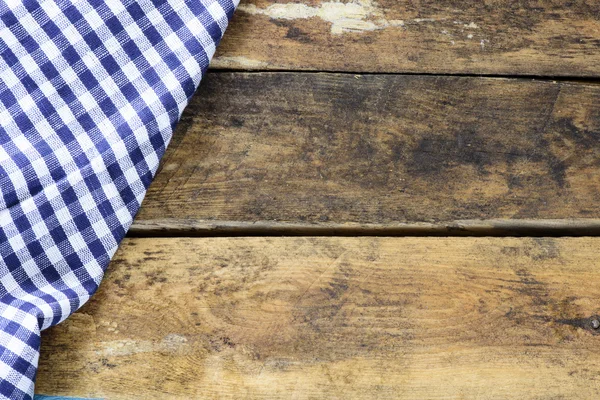 Wooden backgrond with piece of cloth — Stock Photo, Image