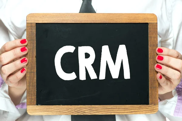 Blackboard with  handwritten CRM — Stock Photo, Image