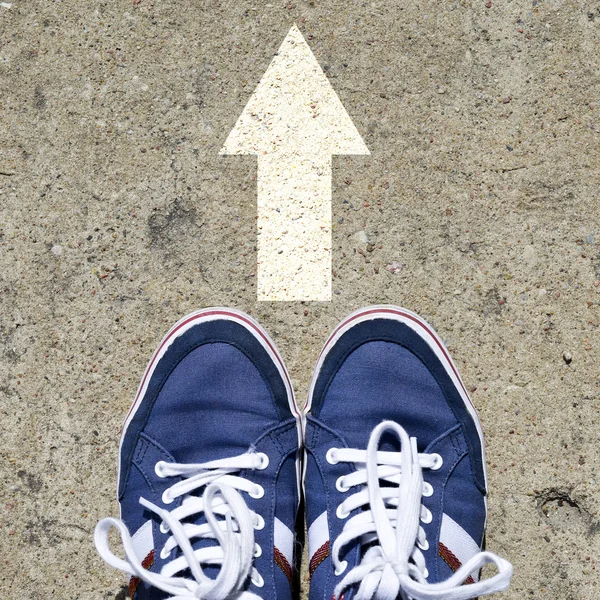 Male sneakers with drawn direction arrow — Stock Photo, Image