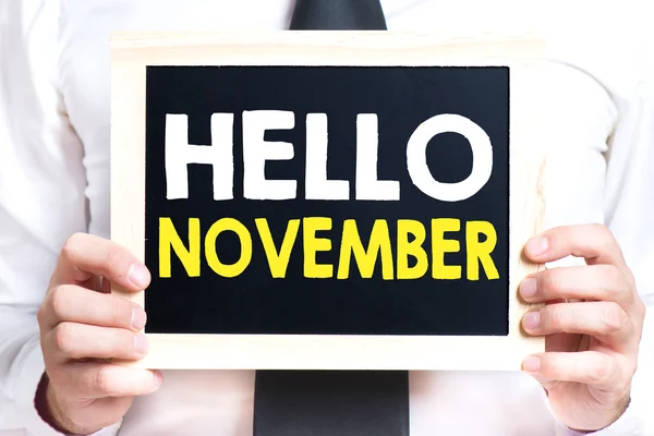 Ręce trzymając tablica z hello listopada — Zdjęcie stockowe