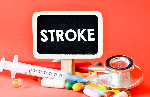Tavlan med stroke och piller — Stockfoto