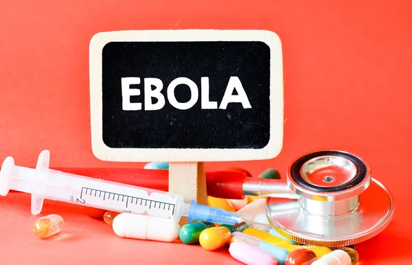 Blackboard with ebola and pills — Stock Photo, Image