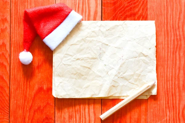 Merry christmas list z santa hat — Zdjęcie stockowe