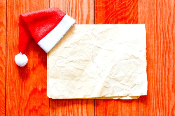 Feliz carta de Navidad con sombrero de santa —  Fotos de Stock