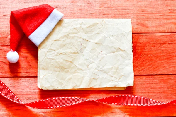 Feliz carta de Navidad con sombrero de santa —  Fotos de Stock