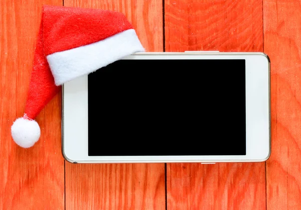 Smartphon  in  christmas hat — Stock Photo, Image