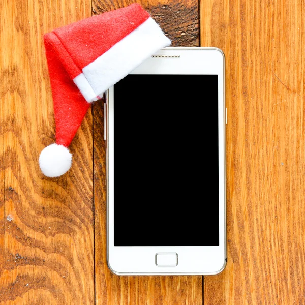 Smartphon Noel şapkalı — Stok fotoğraf