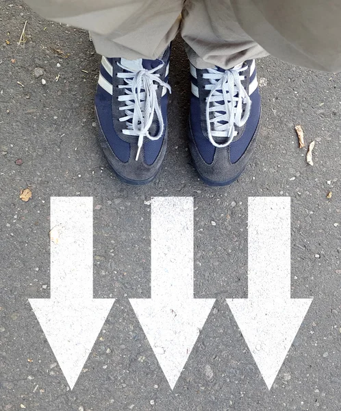 Male sneakers with drawn direction arrows — Stock Photo, Image