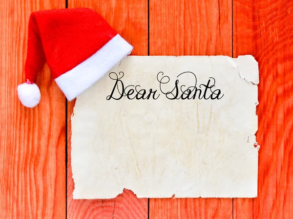 Merry christmas letter with santa hat — Stock Photo, Image