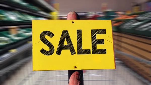 Carrito de compras en la tienda con venta — Foto de Stock