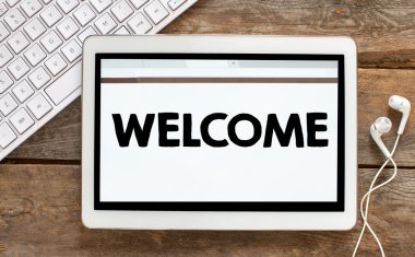 Tablet pc ile hoş geldiniz ve kulaklıklar