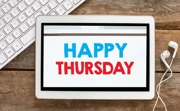 Tablet pc with happy thursday — Stock Photo, Image