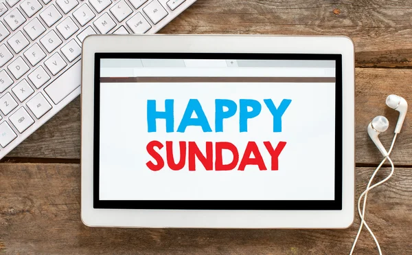 Tablet pc with happy sunday — Stock Photo, Image