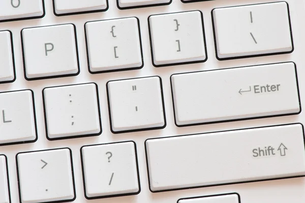 Botões no teclado branco — Fotografia de Stock