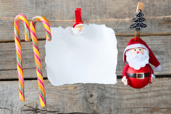 Kerstdecoratie en lege papier blad — Stockfoto