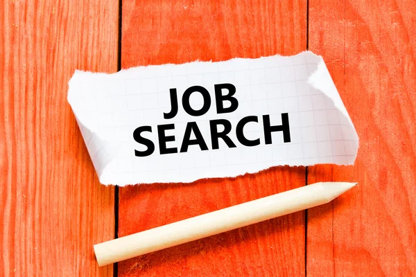 Papel com inscrição de busca de emprego — Fotografia de Stock