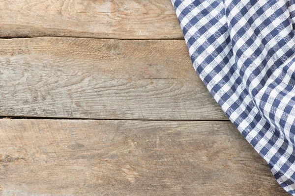 Wooden backgrond with piece of cloth — Stock Photo, Image