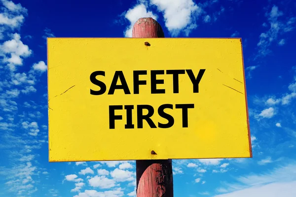 Signboard with safety first  inscription — Stock Photo, Image