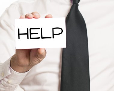 Yardım metni ile kağıt tutan işadamı