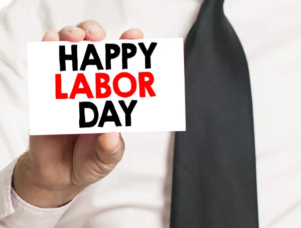 Hand med glad labor day card — Stockfoto