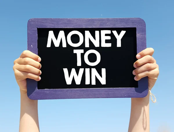 Hands holding blackboard with  Money to win — Stock Photo, Image