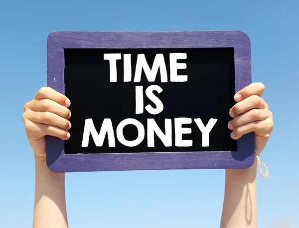 Hands holding blackboard with  time is money — Stock Photo, Image