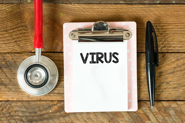 Clipboard with virus inscription — Stock Photo, Image