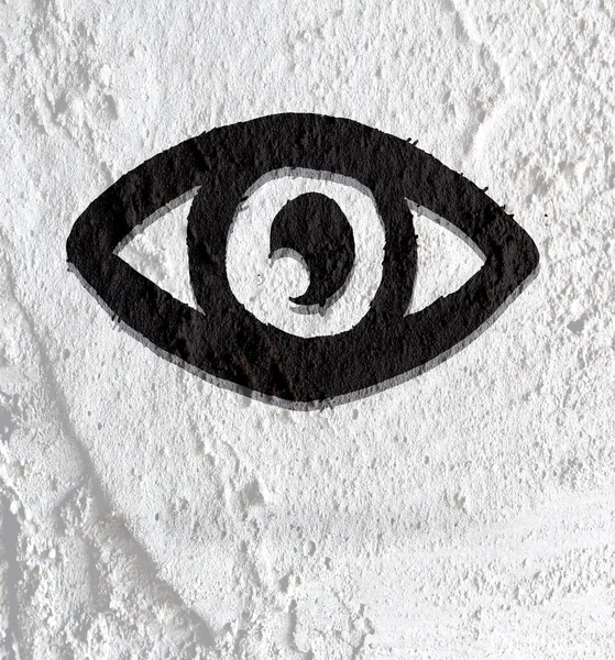 Eye icon character design on Cement wall texture background — Stock Photo, Image