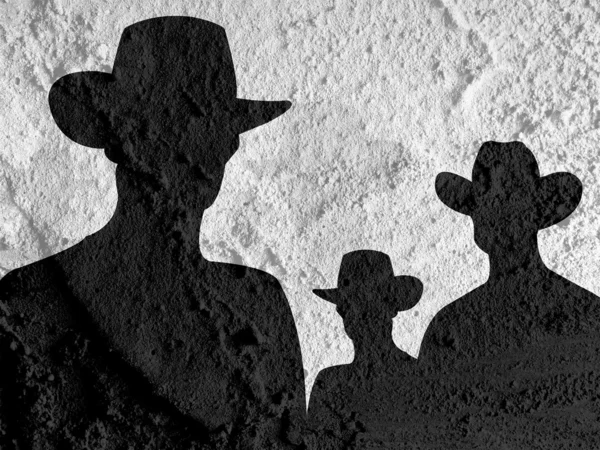 Cowboy pessoas silhueta no cimento parede textura fundo desi — Fotografia de Stock