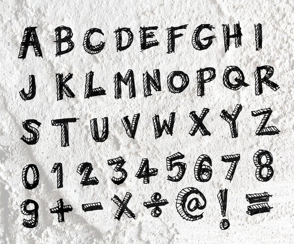 Hand drawn letters font written on wall texture background desig