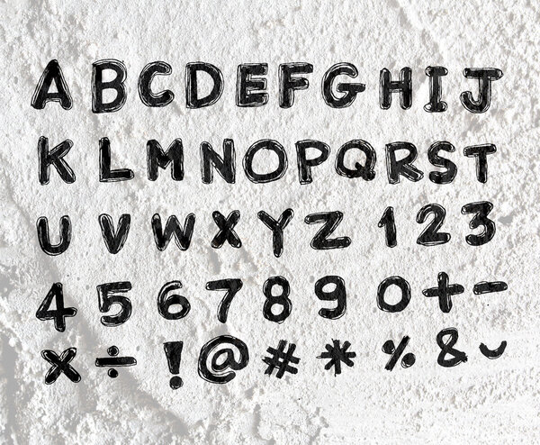 Hand drawn letters font written on wall texture background desig
