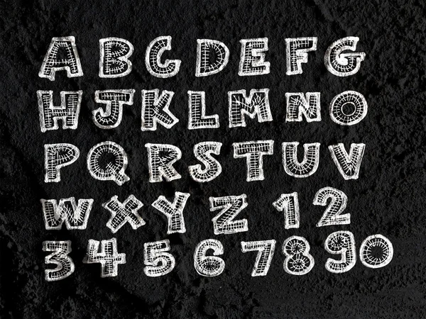 Hand getrokken brieven lettertype geschreven op de muur textuur achtergrond desig — Stockfoto