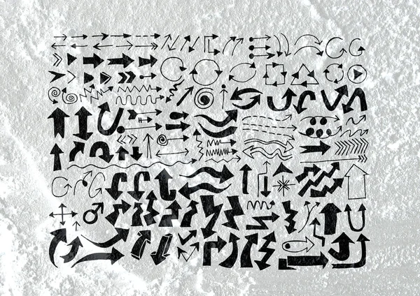 Šipky a ručně kreslenou skica šipky sbírku na zdi textury ba — Stock fotografie
