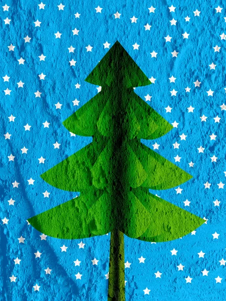 Рождественская елка на стене цемента — стоковое фото
