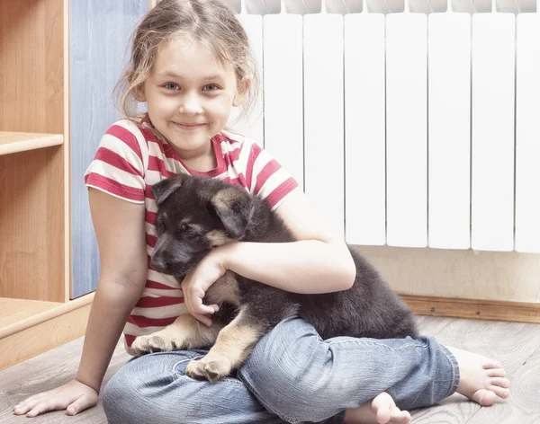 Girl and puppy shepherd dog — Stock Photo, Image