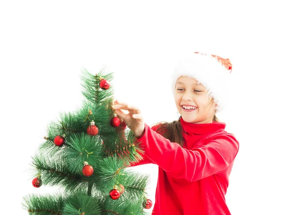 Kind versieren de kerstboom Christmas speelgoed op een witte backgr — Stockfoto