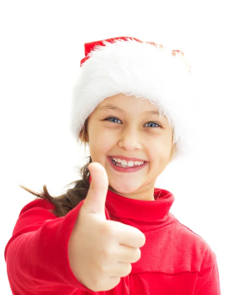 Portrait of a smiling little girl in Santa hat showing thumb — Stock Photo, Image