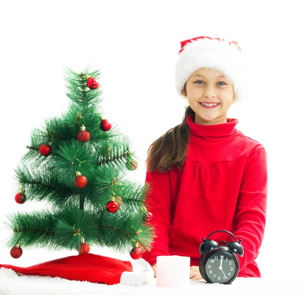 Beautiful little girl is waiting the new year on a white backgro — Stock Photo, Image