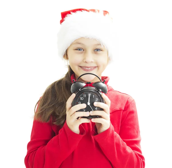 Child in Santa hat holding alarm clock — Stock Photo, Image