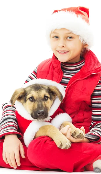 Kid och valp i jul kläder på en vit bakgrund isolatet — Stockfoto
