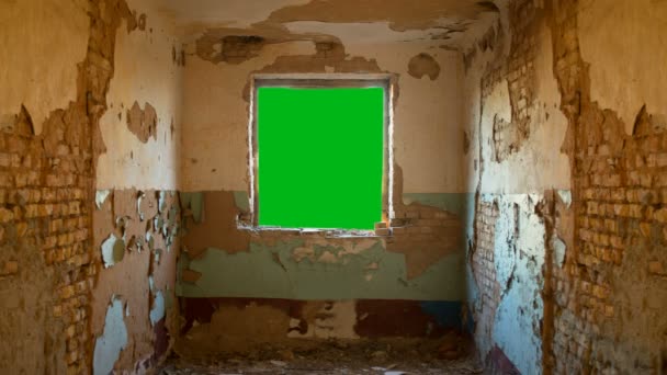 Green window in an abandoned house — Stock Video